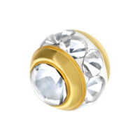 Punta per piercing dorata con cristalli chiari su sfondo bianco