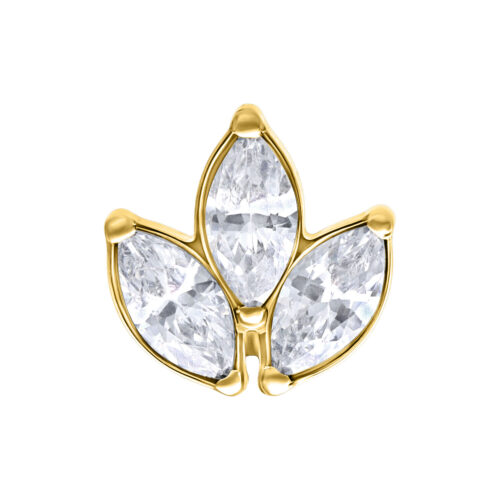 Inserto dorato a forma di fiore con tre cristalli chiari su sfondo bianco