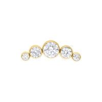 Inserto in metallo dorato con cinque cristalli chiari su sfondo bianco