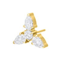 Inserto per piercing dorato con tre cristalli chiari su sfondo bianco