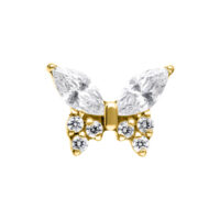 Accessorio a farfalla dorata con cristalli chiari su sfondo bianco