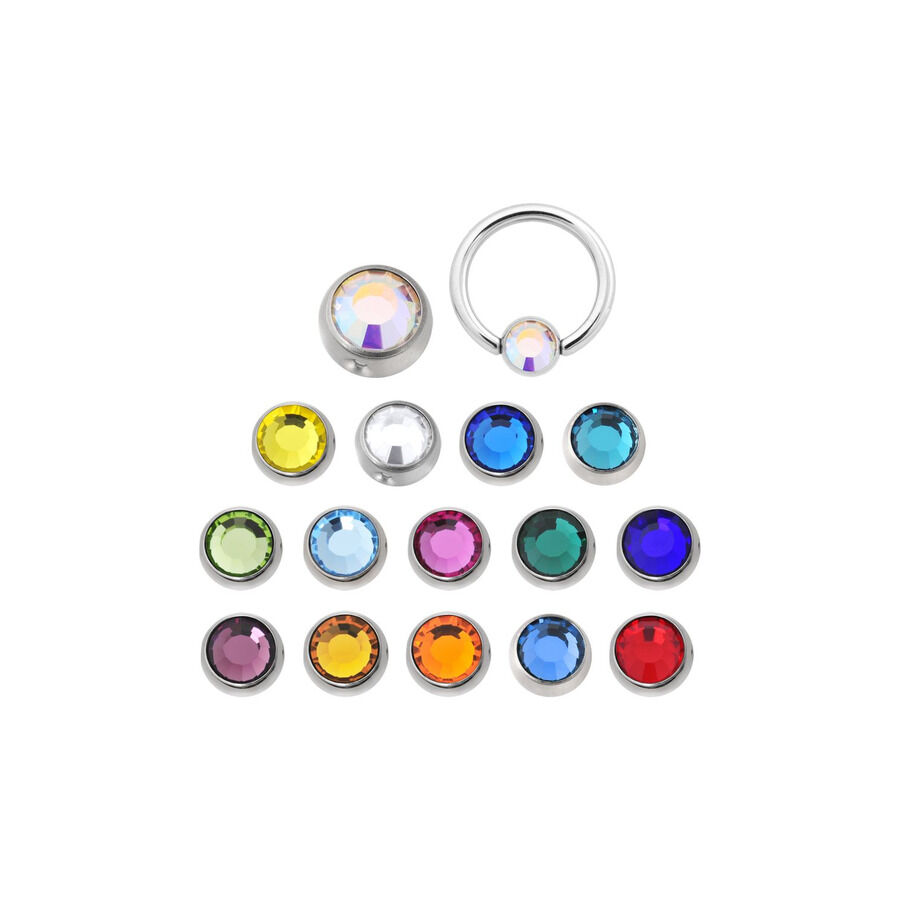 Sfera colorata in titanio per piercing Diverse sfere in titanio con cristalli colorati su sfondo bianco