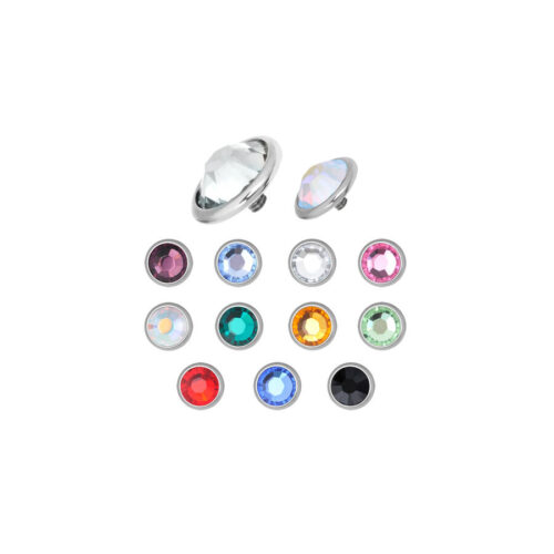 Attacchi in titanio argentato con cristalli colorati su sfondo bianco
