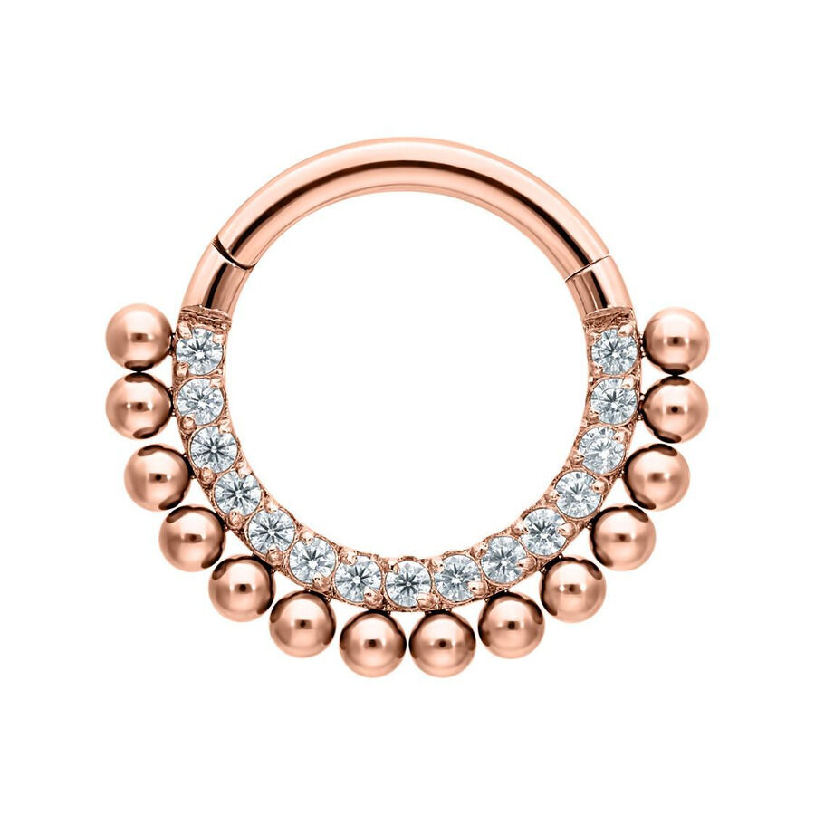 Piercing clicker in oro rosa con cristalli chiari su sfondo bianco