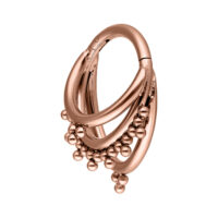Triplo Clicker Orientale in titanio oro rosa con sfere pendenti su sfondo bianco