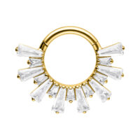 Clicker septum dorato con cristalli scintillanti su sfondo bianco