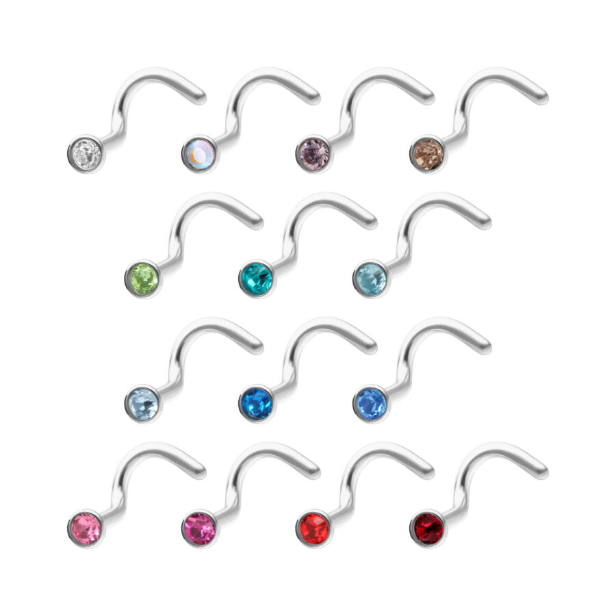 Vari piercing nasali in titanio con cristalli colorati su sfondo bianco
