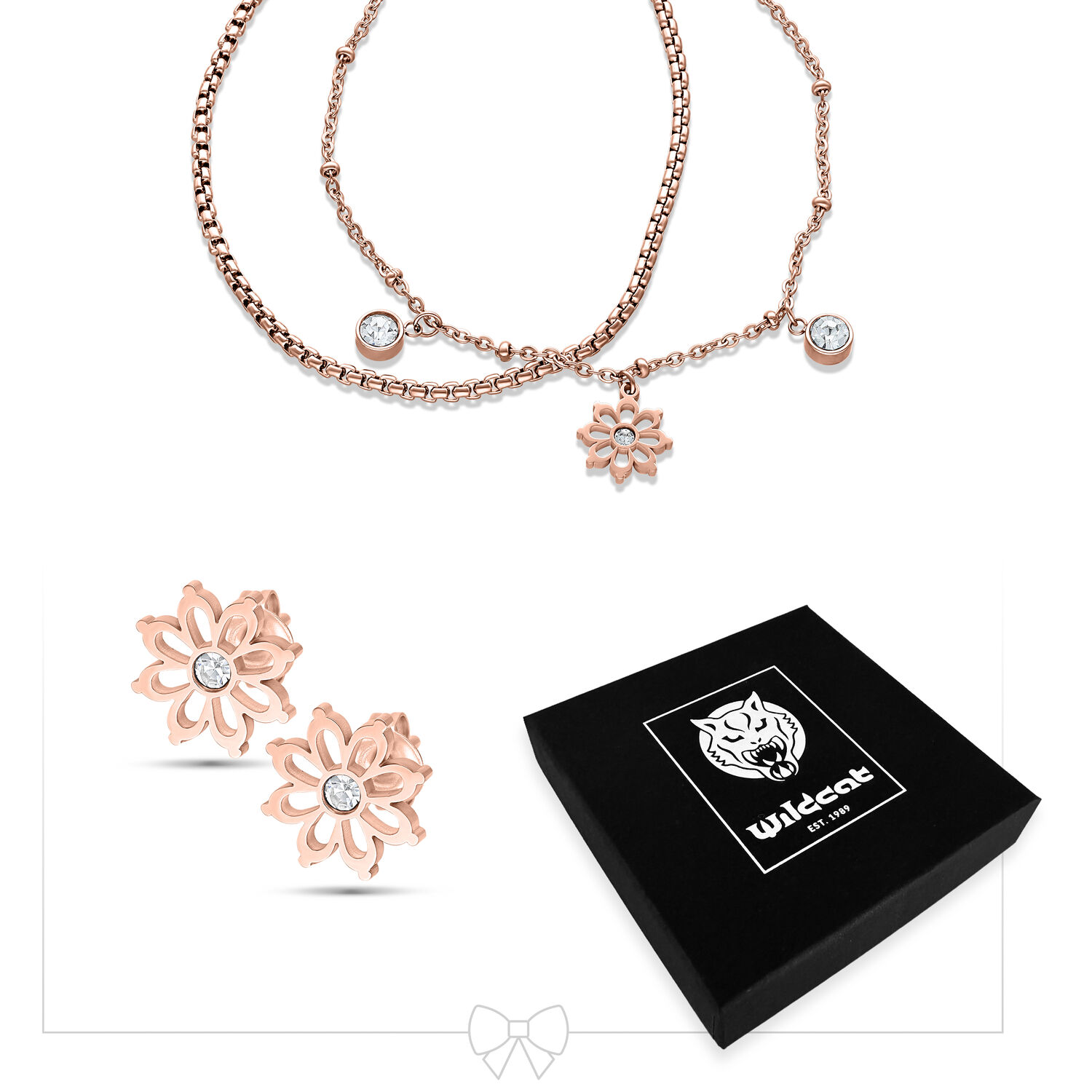 Bracciale in oro rosa con ciondolo a fiore e orecchini su sfondo bianco, scatola nera Wildcat