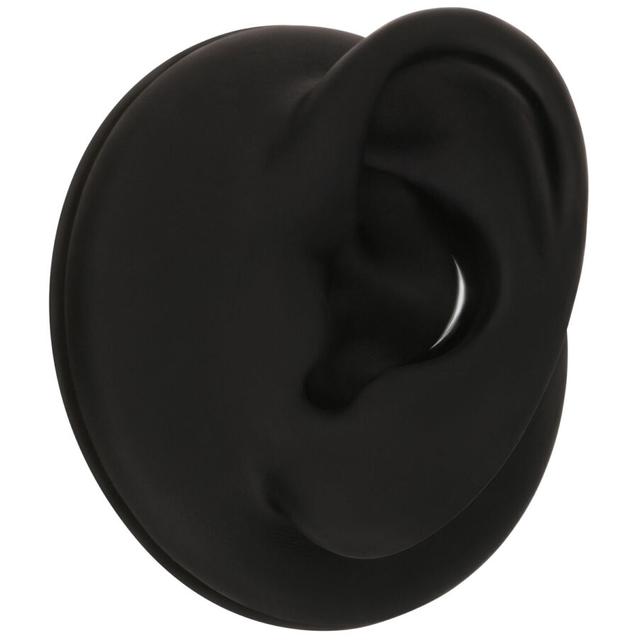 Accessorio nero per l'orecchio di forma ovale, fotografato lateralmente