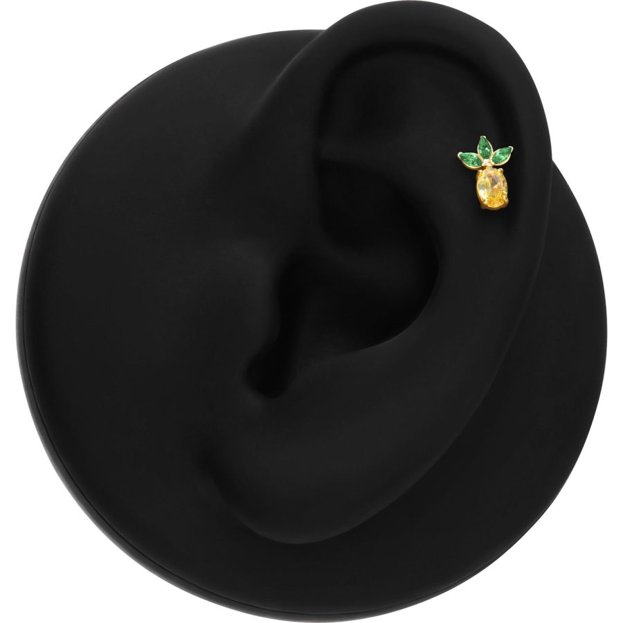 Accessorio Ananas Dorato con foglie verdi su display nero per orecchio